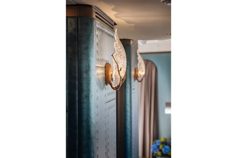 Slide: The Image of Elegant interior lighting on Sirena 118 yacht, 2027 model, featuring artistic wall sconces. - 18