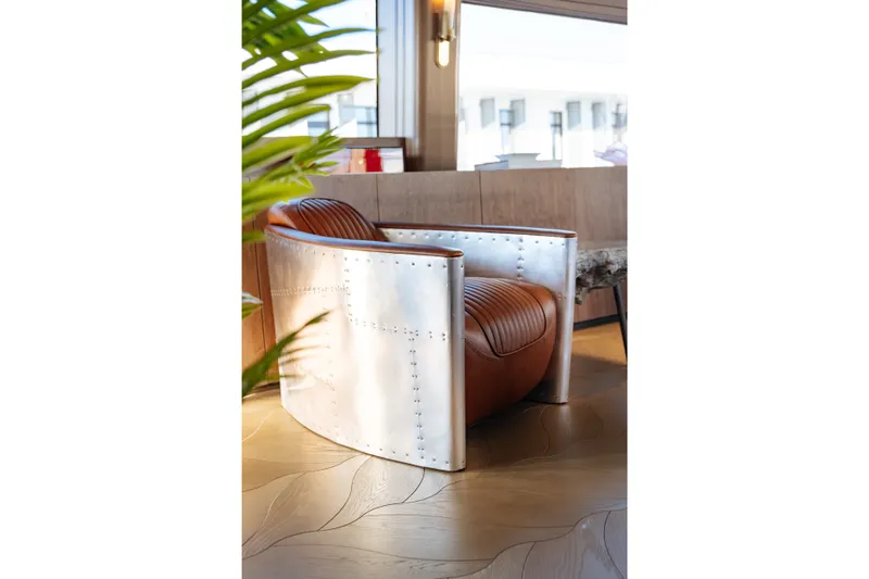 Slide: The Image of Modern leather and metal chair in a stylish interior, Sirena 118, 2027 model. - 16