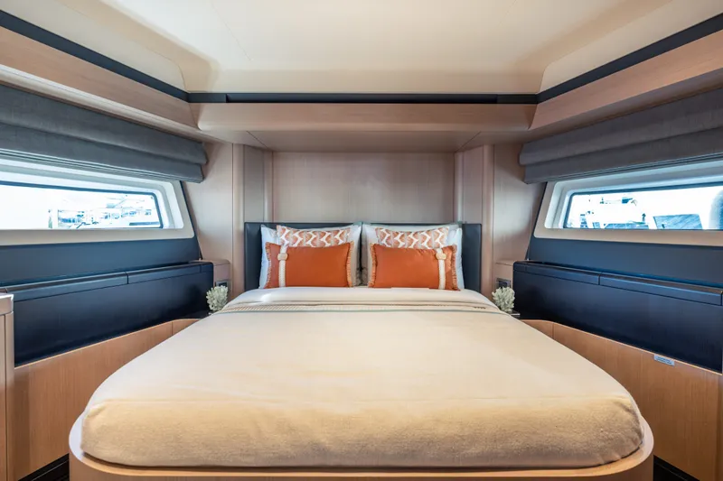 Slide: The Image of Luxurious bedroom interior of 2027 Sirena 118 yacht with elegant bedding and large windows. - 28
