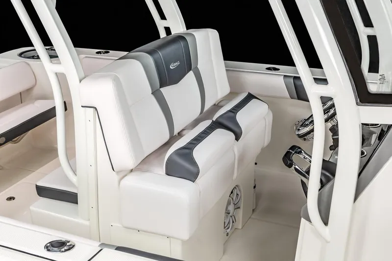 Slide: The Image of Manufacturer Provided Image: 2020 Robalo R272 Center Console boat interior with cushioned seating and steering console. - 9