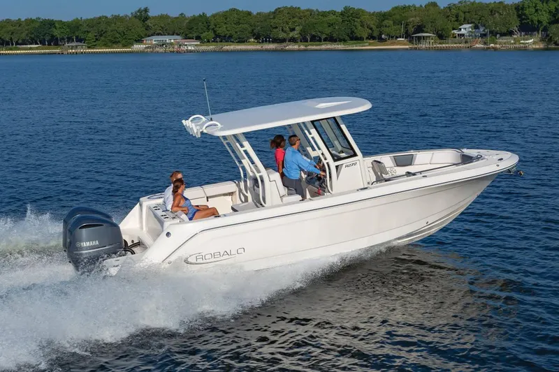 Slide: The Image of Manufacturer Provided Image: 2020 Robalo R272 Center Console boat cruising on a lake with passengers. - 1