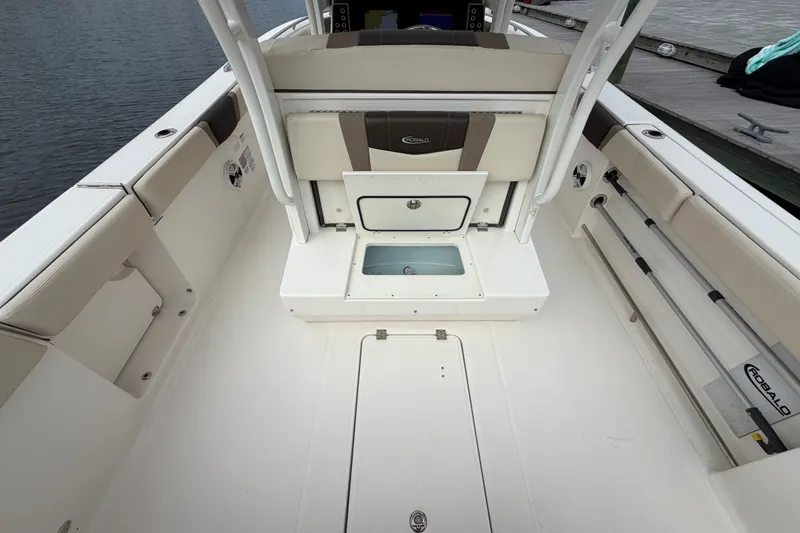 Slide: The Image of 2020 Robalo R272 Center Console boat interior with seating and storage compartments. - 34
