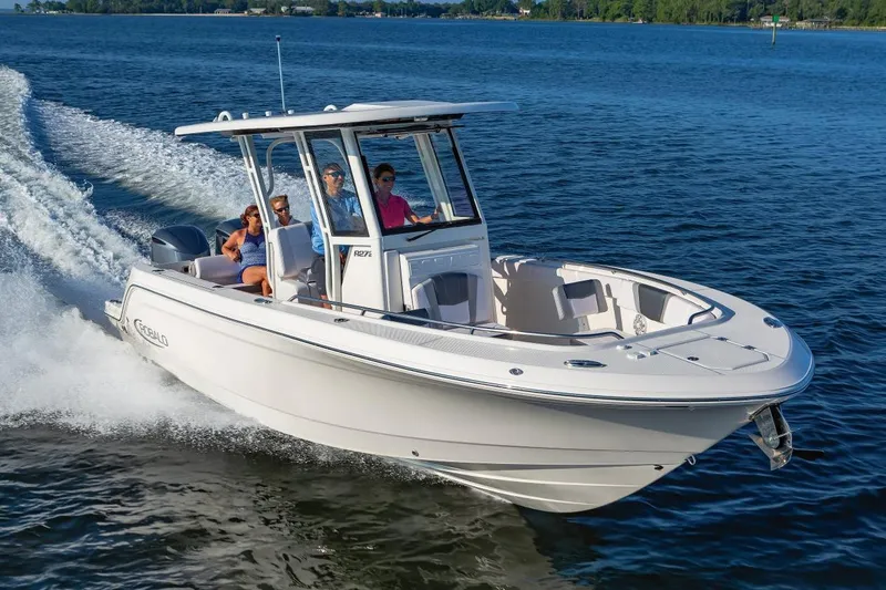 Slide: The Image of Manufacturer Provided Image: 2020 Robalo R272 Center Console boat cruising on water with passengers. - 0