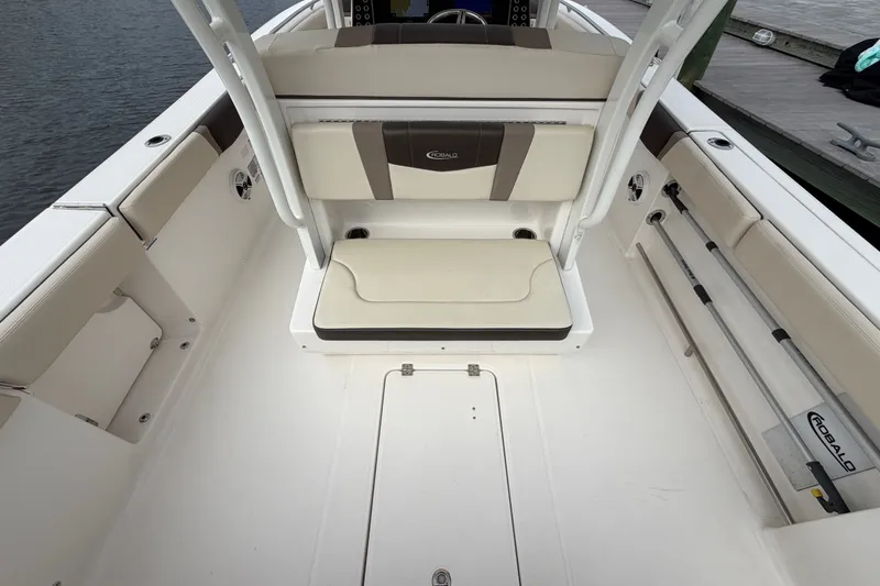 Slide: The Image of 2020 Robalo R272 Center Console boat interior with seating and storage compartments. - 33