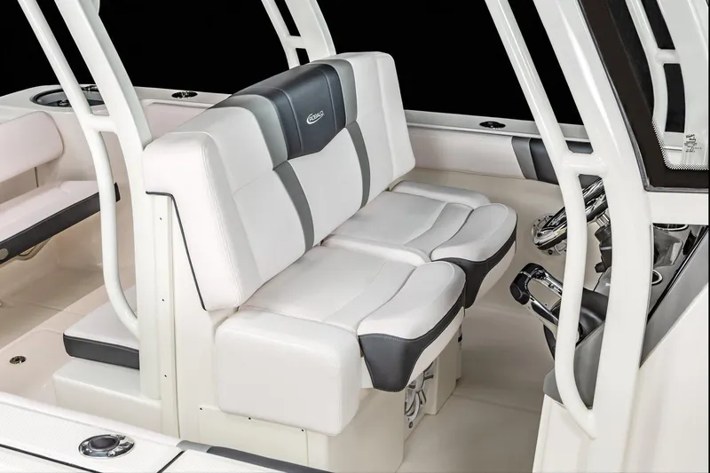 Slide: The Image of Manufacturer Provided Image: 2020 Robalo R272 Center Console boat seating area with white and gray upholstery. - 8