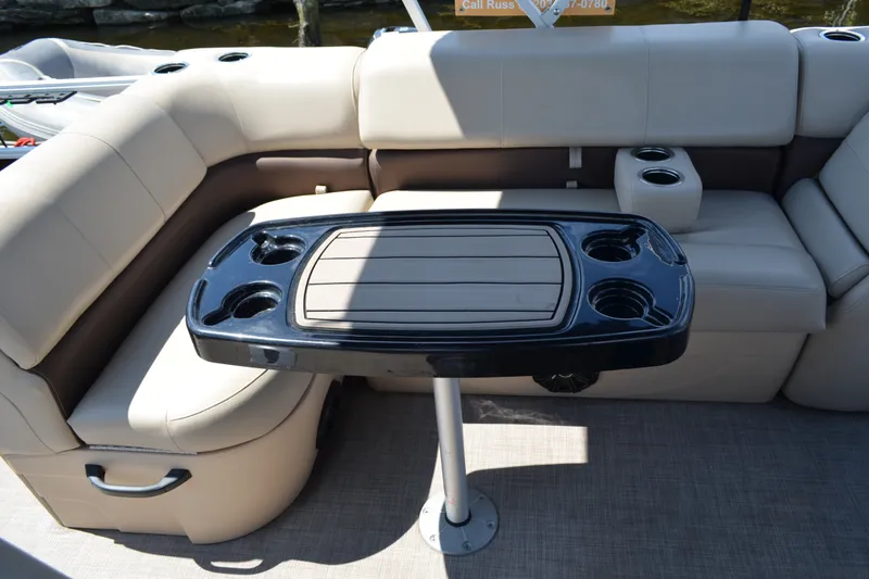 Slide: The Image of 2019 Sun Tracker Fishin' Barge 20 DLX interior with seating and table. - 18