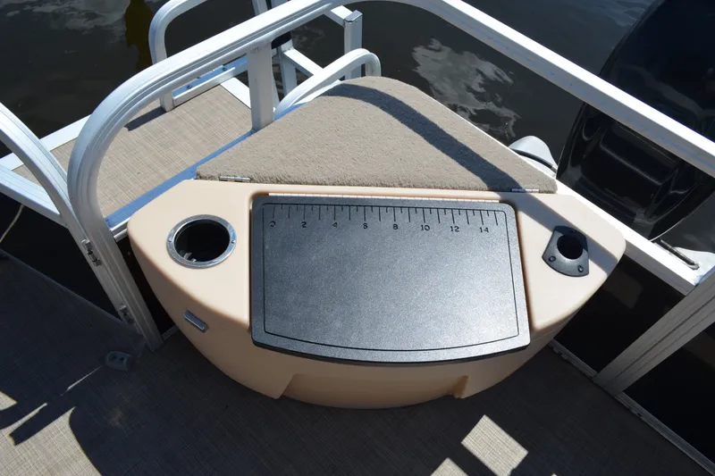 Slide: The Image of 2019 Sun Tracker Fishin' Barge 20 DLX fishing station with measuring board and cup holder. - 21