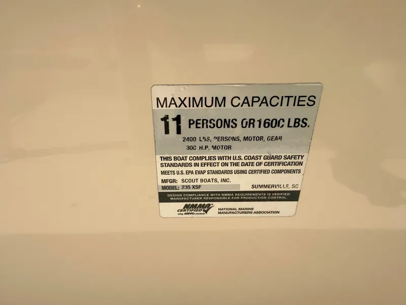 Slide: The Image of Plaque showing maximum capacity: 11 persons or 1600 lbs, 300 HP motor. - 17