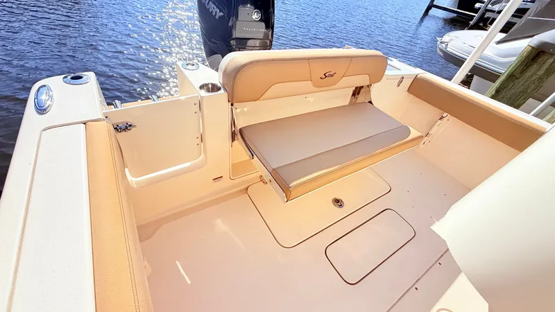 Slide: The Image of The image shows the cockpit of a 2018 Scout 235 XSF with beige upholstery. - 7