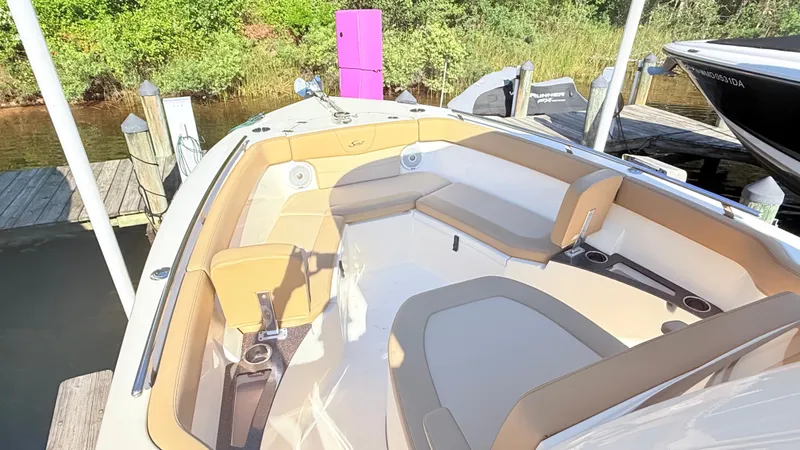 Slide: The Image of 2018 Scout 235 XSF with beige upholstery, docked at a pier. - 5