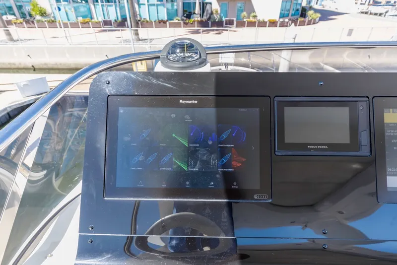 Slide: The Image of Control panel of a 2021 Azimut Fly 60 yacht with navigation displays. - 23