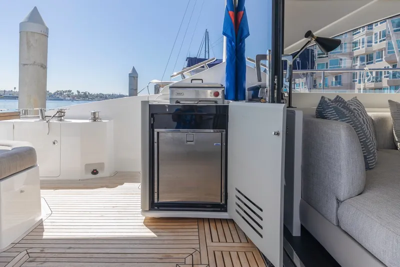 Slide: The Image of Azimut Fly 60 yacht deck with seating and outdoor kitchen, 2021 model. - 12