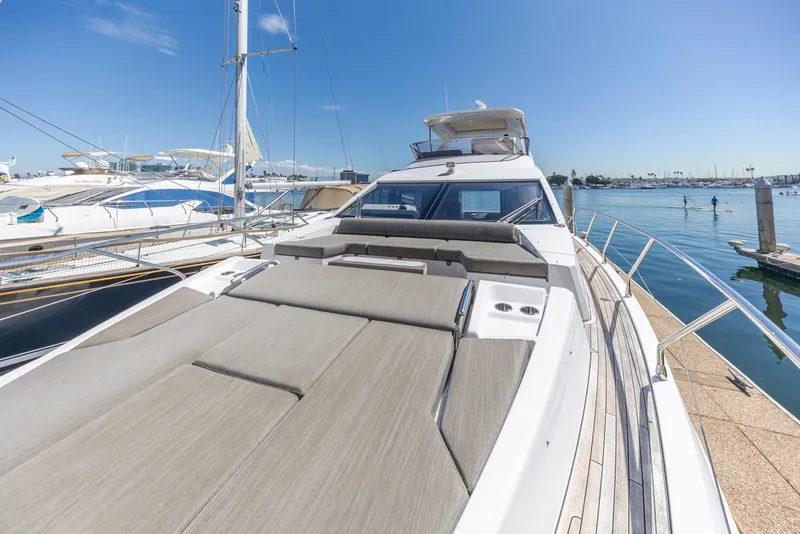 Slide: The Image of Luxurious 2021 Azimut Fly 60 yacht docked at marina under clear blue sky. - 35