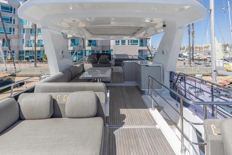 Slide: The Image of Luxurious 2021 Azimut Fly 60 yacht deck with elegant seating and modern design. - 17