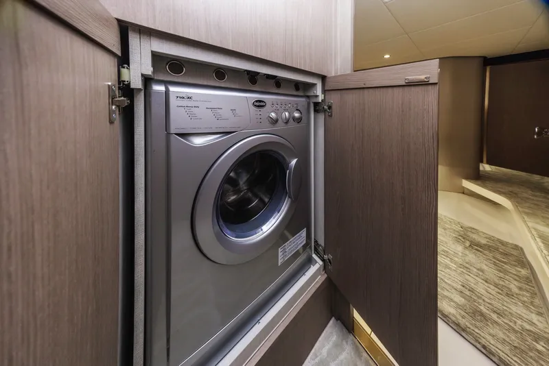 Slide: The Image of Washing machine inside Azimut Fly 60 yacht, 2021 model, with wooden cabinetry. - 49