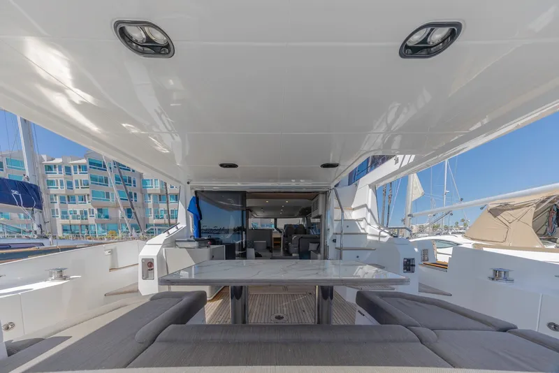 Slide: The Image of Luxurious 2021 Azimut Fly 60 yacht interior with elegant seating and dining area. - 9