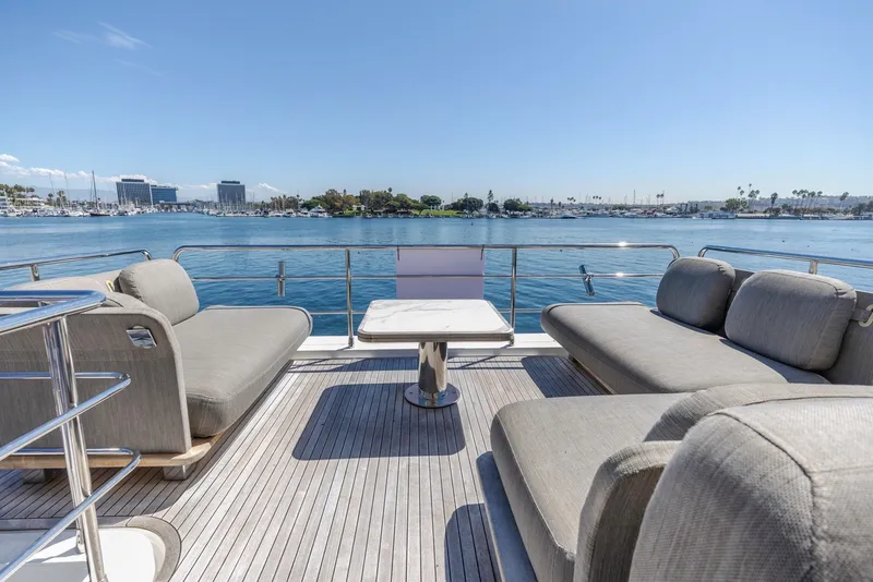 Slide: The Image of Luxury deck of 2021 Azimut Fly 60 yacht with ocean view and comfortable seating. - 29