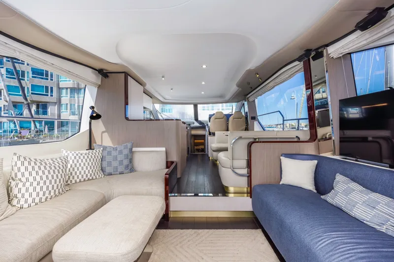 Slide: The Image of Luxurious interior of 2021 Azimut Fly 60 yacht with modern seating and large windows. - 36