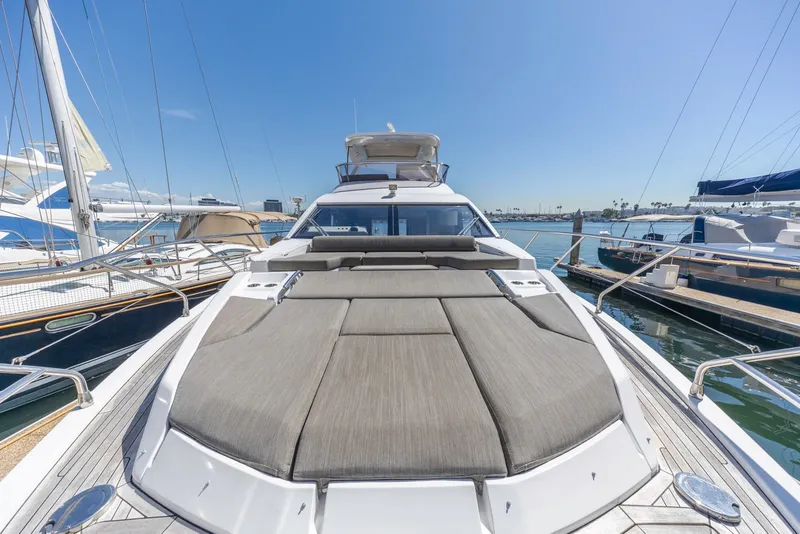 Slide: The Image of 2021 Azimut Fly 60 yacht with spacious sun deck, docked in a marina. - 34