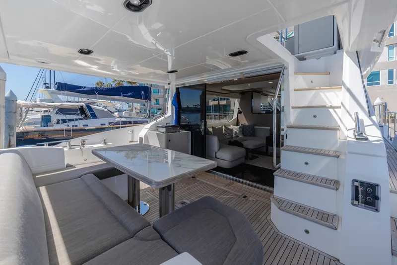 Slide: The Image of Luxurious 2021 Azimut Fly 60 yacht interior with elegant seating and dining area. - 11