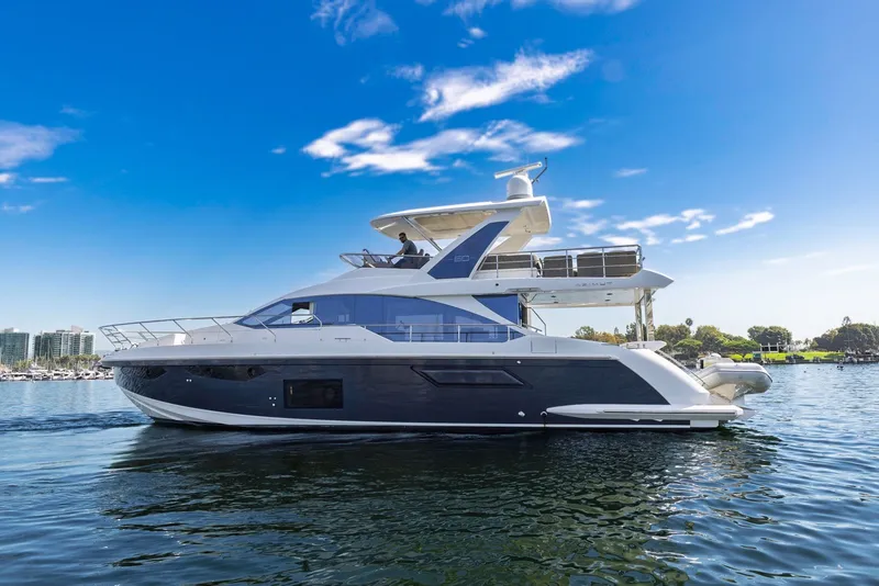 Slide: The Image of Azimut Fly 60 yacht, 2021 model, cruising on a sunny day with clear blue skies. - 1