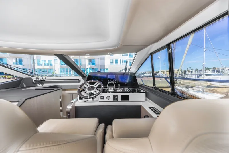 Slide: The Image of Luxurious interior of 2021 Azimut Fly 60 yacht with modern helm and panoramic windows. - 41