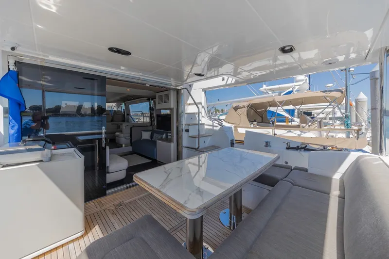 Slide: The Image of Luxurious 2021 Azimut Fly 60 yacht interior with elegant seating and dining area. - 10