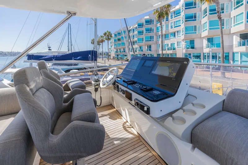 Slide: The Image of Luxurious 2021 Azimut Fly 60 yacht helm with modern controls and waterfront view. - 21