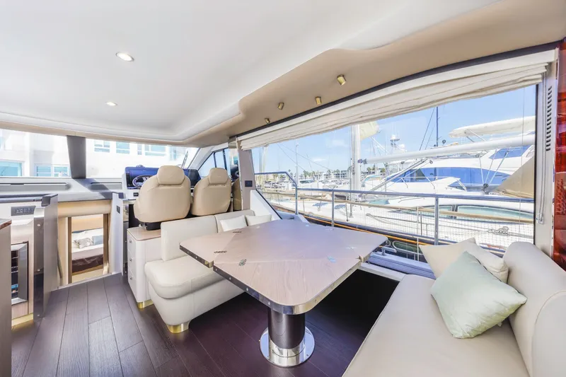Slide: The Image of Luxurious interior of 2021 Azimut Fly 60 yacht with elegant seating and large windows. - 39