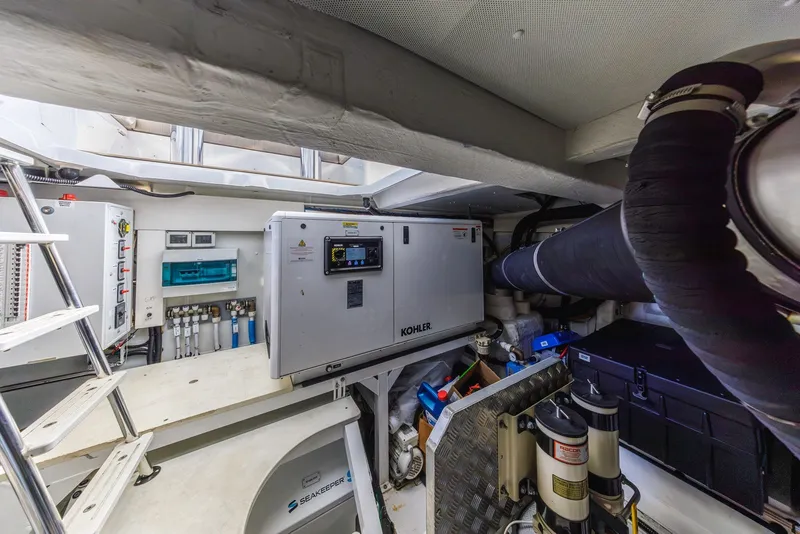 Slide: The Image of Engine room of 2021 Azimut Fly 60 yacht with Kohler generator and Seakeeper stabilizer. - 67