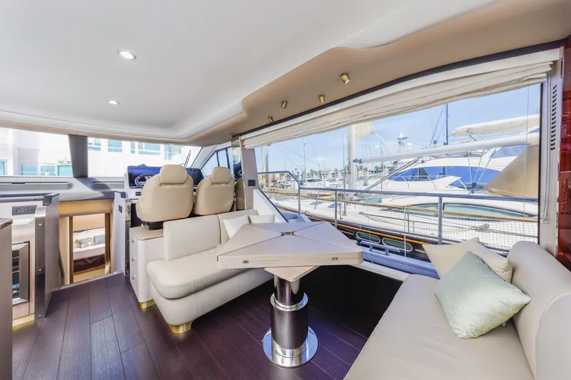 Slide: The Image of Luxurious interior of 2021 Azimut Fly 60 yacht with elegant seating and panoramic windows. - 38