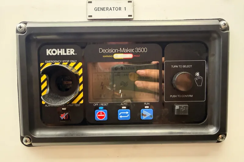 Slide: The Image of Control panel of Kohler Decision-Maker 3500 generator on 2021 Azimut Fly 60 yacht. - 71