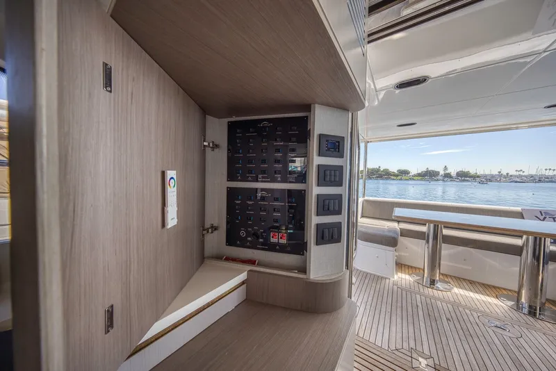 Slide: The Image of Control panel on 2021 Azimut Fly 60 yacht with scenic water view. - 62