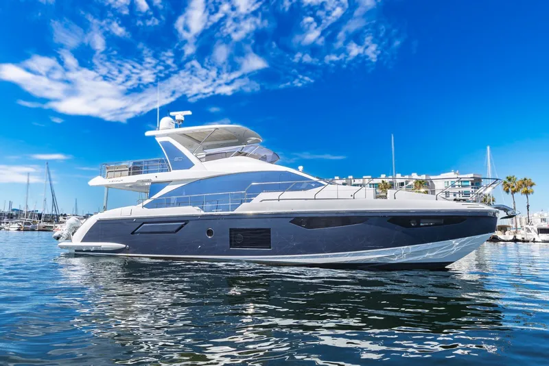 Slide: The Image of Luxury 2021 Azimut Fly 60 yacht docked in a sunny marina. - 0