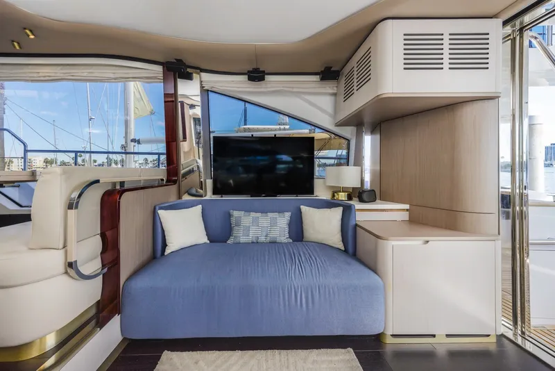 Slide: The Image of Luxurious interior of 2021 Azimut Fly 60 yacht with modern seating and large window views. - 61