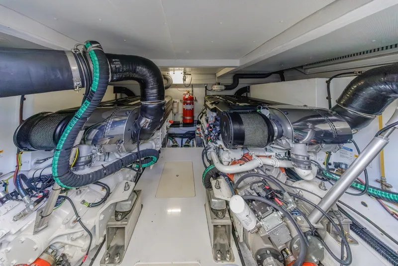 Slide: The Image of Engine room of 2021 Azimut Fly 60 yacht, featuring advanced machinery and equipment. - 63