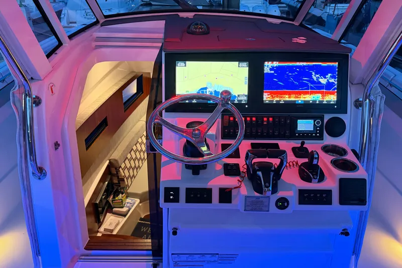 Slide: The Image of Helm of 2022 Pursuit S 378 Sport boat with advanced navigation displays. - 24
