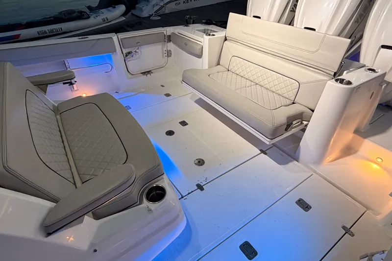 Slide: The Image of Luxurious seating area on 2022 Pursuit S 378 Sport boat with ambient lighting. - 43