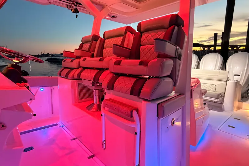 Slide: The Image of Luxurious interior of 2022 Pursuit S 378 Sport boat with illuminated seating at sunset. - 19