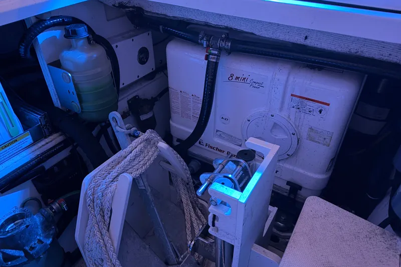 Slide: The Image of Engine compartment of a 2022 Pursuit S 378 Sport boat with Fischer Panda generator. - 58