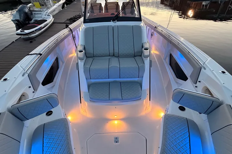 Slide: The Image of Luxurious 2022 Pursuit S 378 Sport boat interior with ambient lighting at sunset. - 12