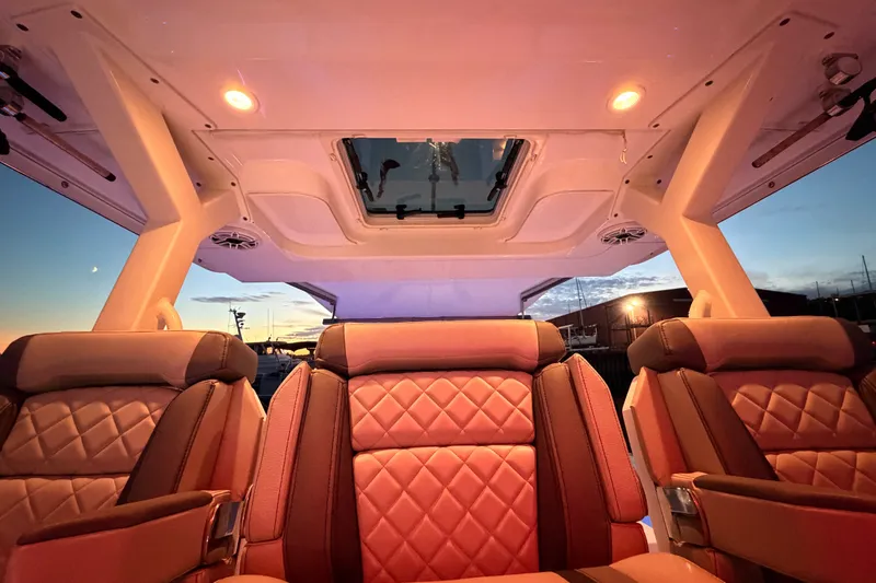 Slide: The Image of Luxurious interior of 2022 Pursuit S 378 Sport boat at sunset. - 38