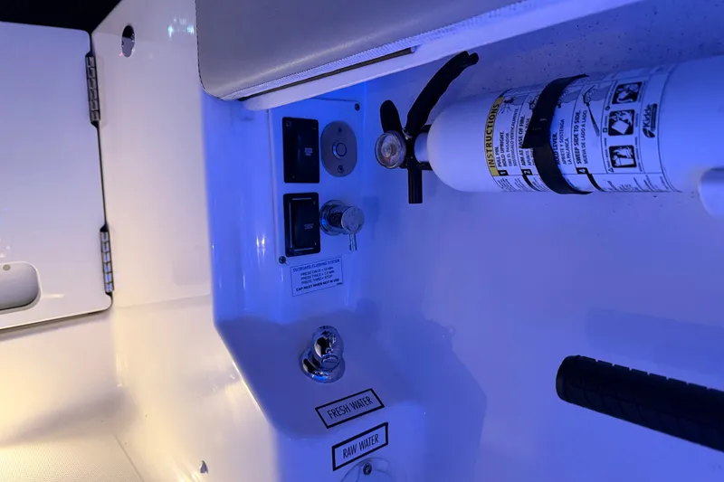 Slide: The Image of Control panel and fire extinguisher on 2022 Pursuit S 378 Sport boat. - 36