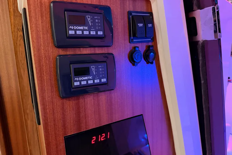 Slide: The Image of Control panel on 2022 Pursuit S 378 Sport boat with Dometic displays and switches. - 51
