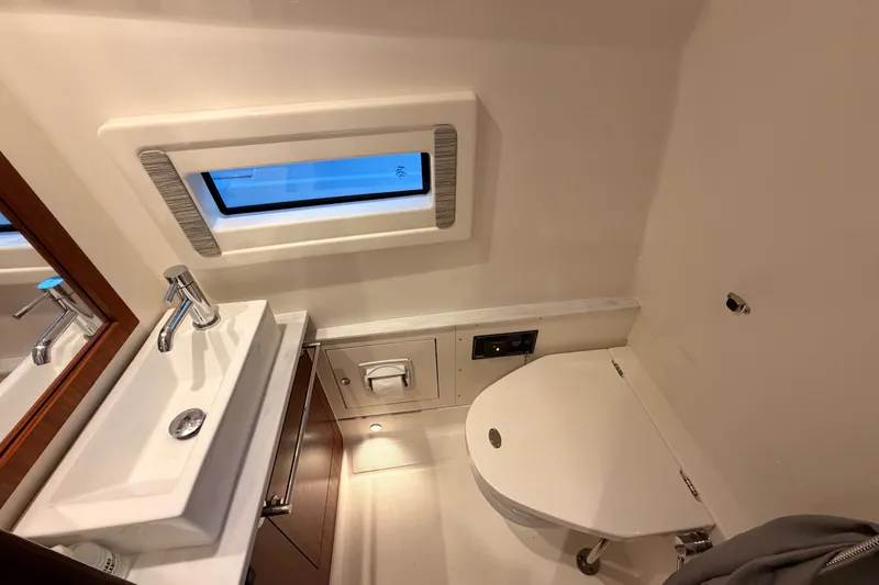 Slide: The Image of Luxurious bathroom in 2022 Pursuit S 378 Sport boat with modern fixtures and window. - 27