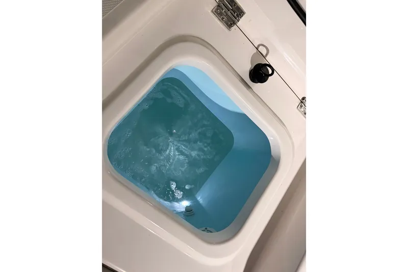 Slide: The Image of Livewell on 2022 Pursuit S 378 Sport boat, filled with water. - 46