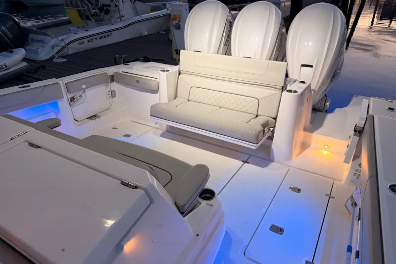 Slide: The Image of 2022 Pursuit S 378 Sport boat interior with seating and illuminated deck. - 42