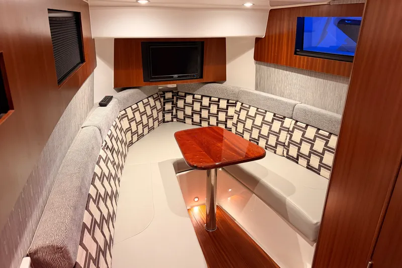 Slide: The Image of Luxurious interior of 2022 Pursuit S 378 Sport boat with elegant seating and table. - 54