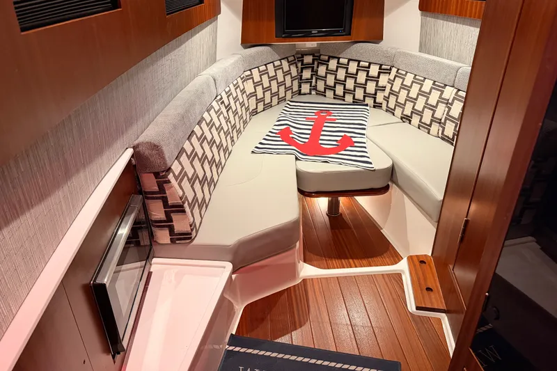 Slide: The Image of Luxurious cabin interior of 2022 Pursuit S 378 Sport boat with stylish seating. - 56