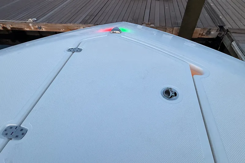 Slide: The Image of Bow of 2022 Pursuit S 378 Sport boat with navigation lights at dock. - 5